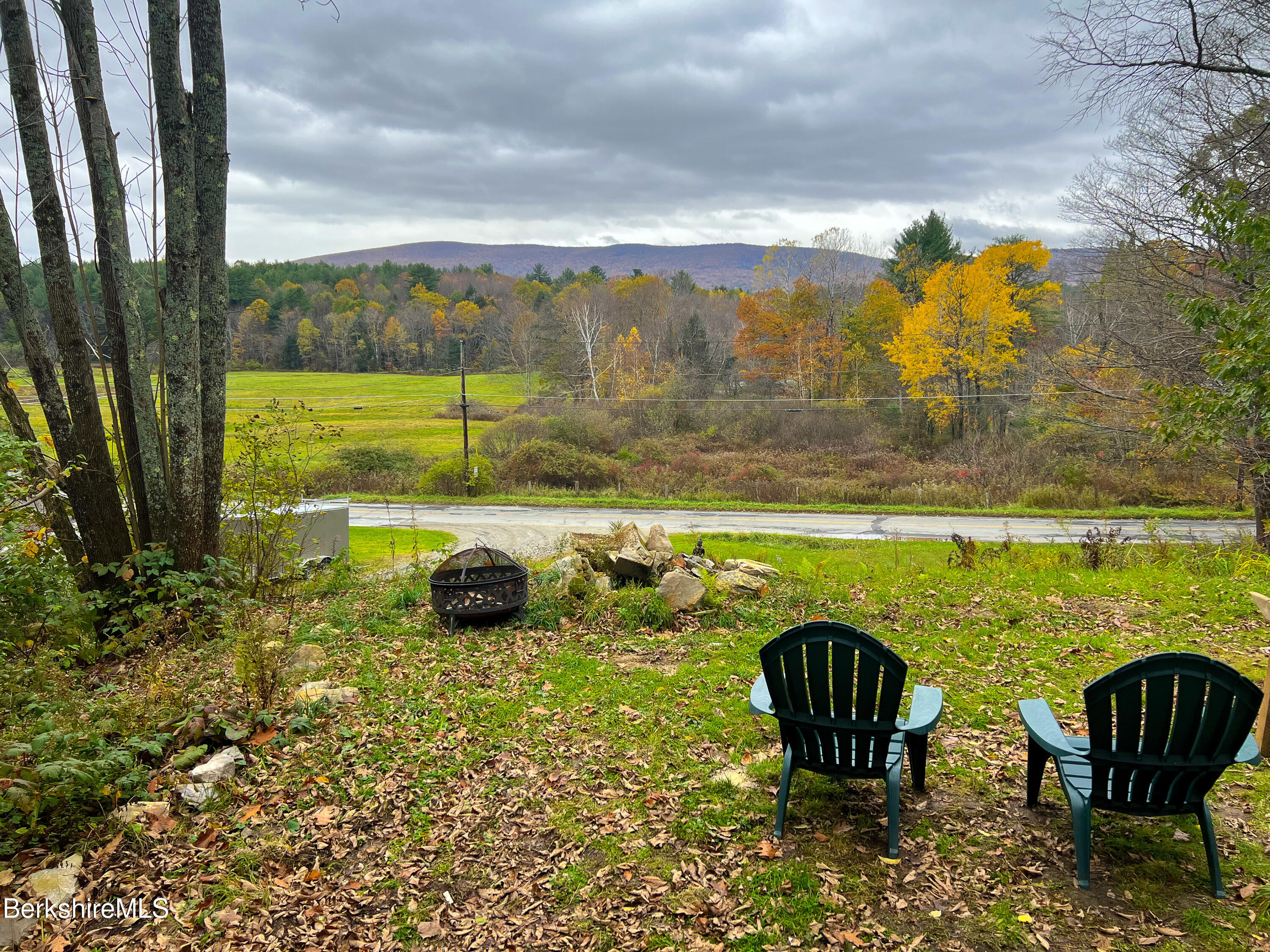 910 Daniels Road Clarksburg, MA 01247 - Photo 3 of 41 a view of a lake with couches in the patio