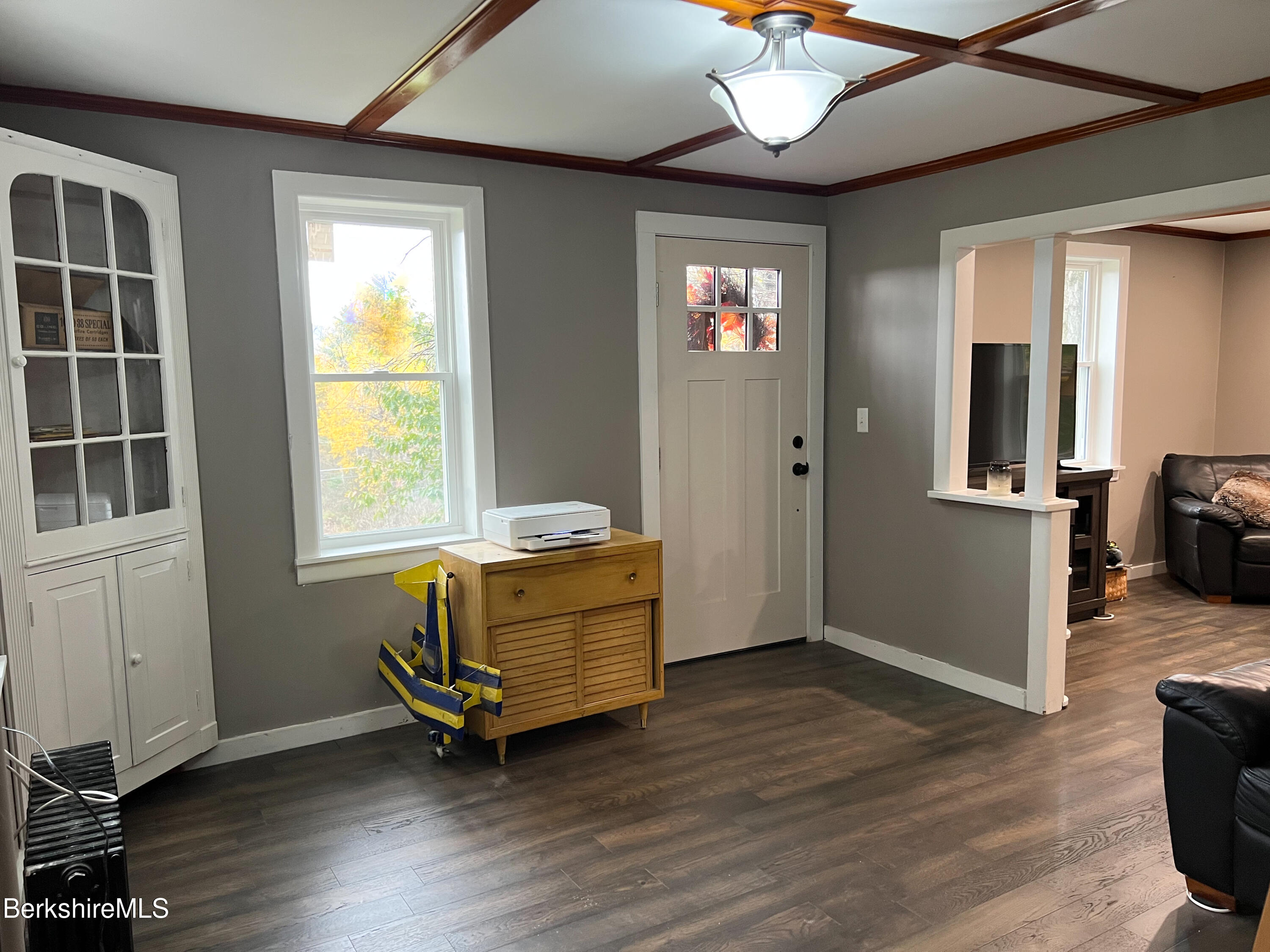 910 Daniels Road Clarksburg, MA 01247 - Photo 21 of 41 an empty room with wooden floor cabinet and windows