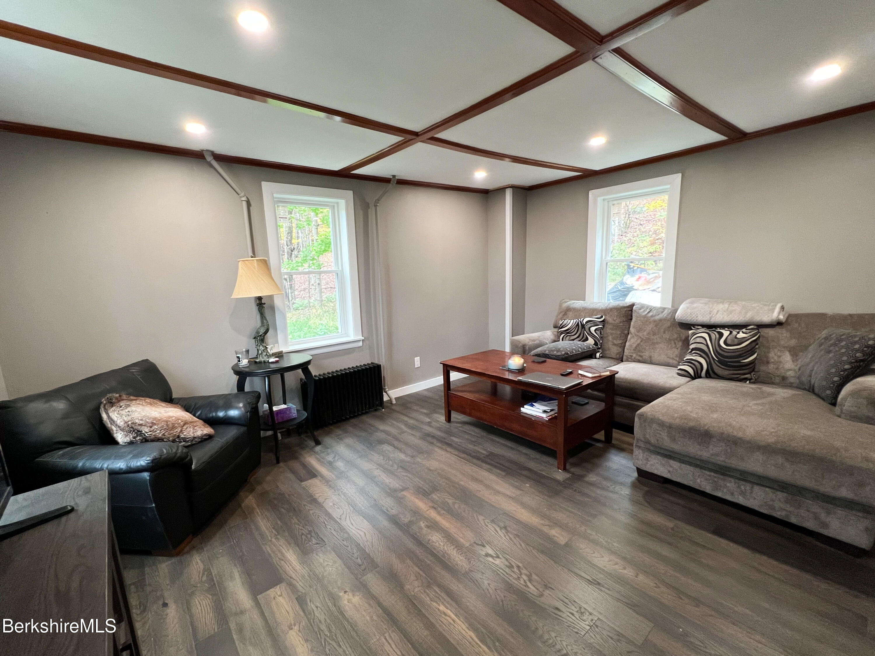 910 Daniels Road Clarksburg, MA 01247 - Photo 28 of 41 a living room with furniture and a wooden floor