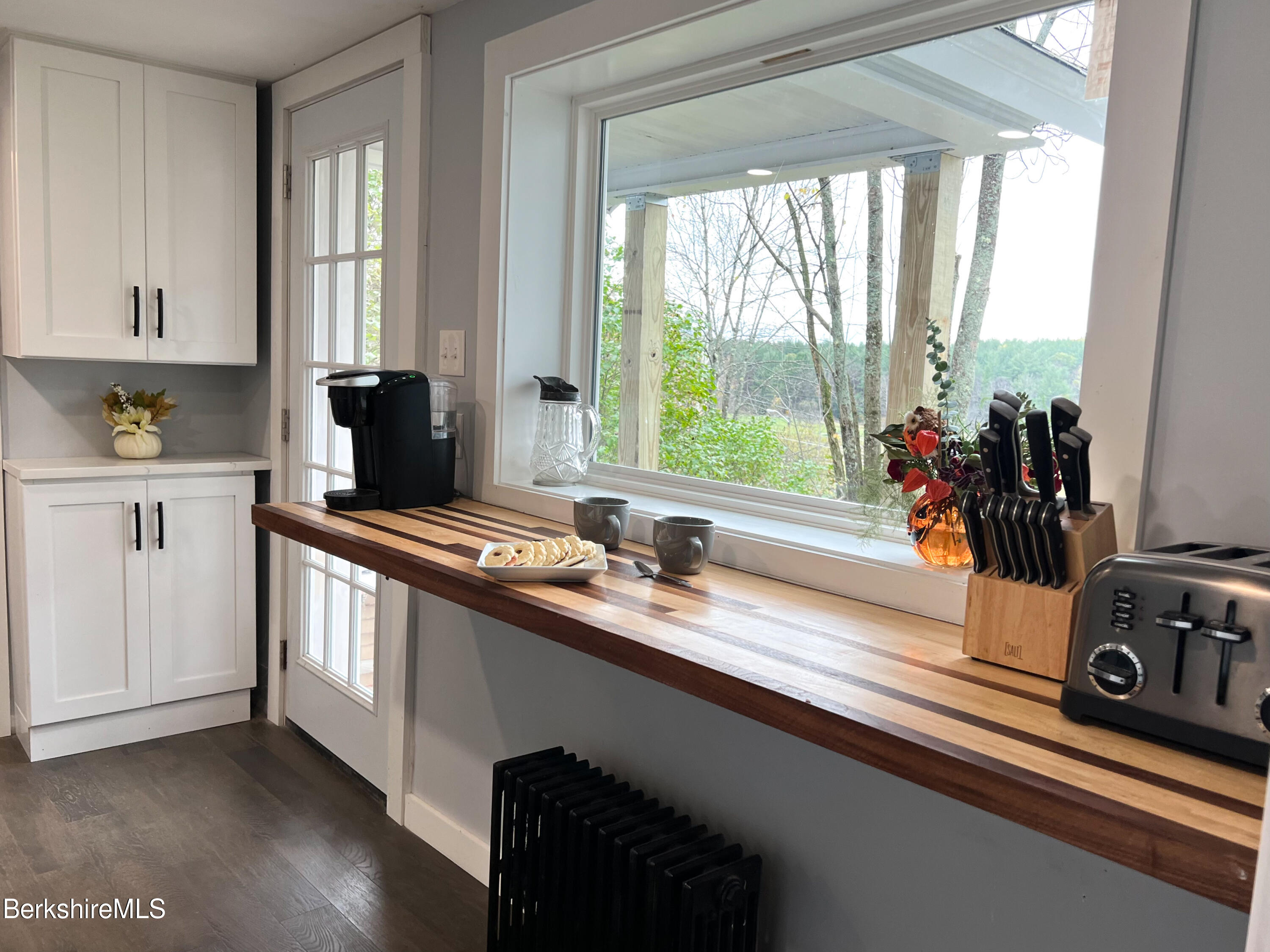 910 Daniels Road Clarksburg, MA 01247 - Photo 5 of 41 a kitchen with stainless steel appliances a sink stove and wooden floor