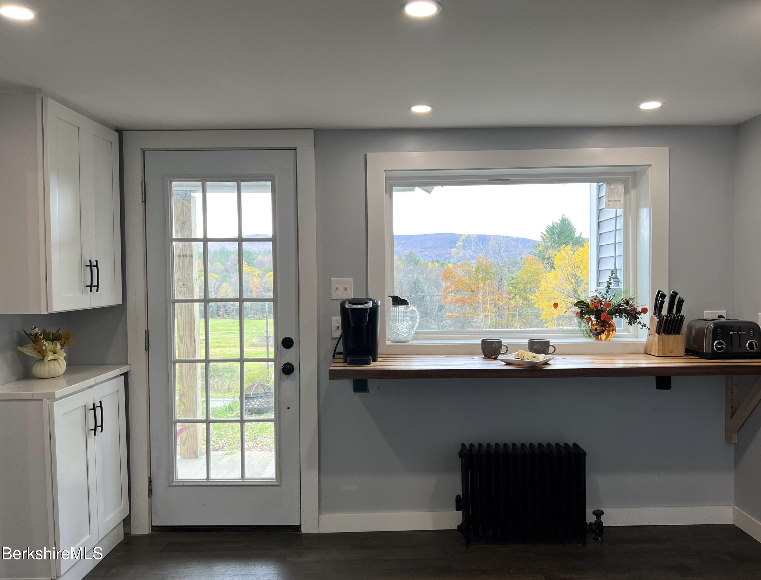 910 Daniels Road Clarksburg, MA 01247 - Photo 7 of 41 a kitchen with a sink and large window