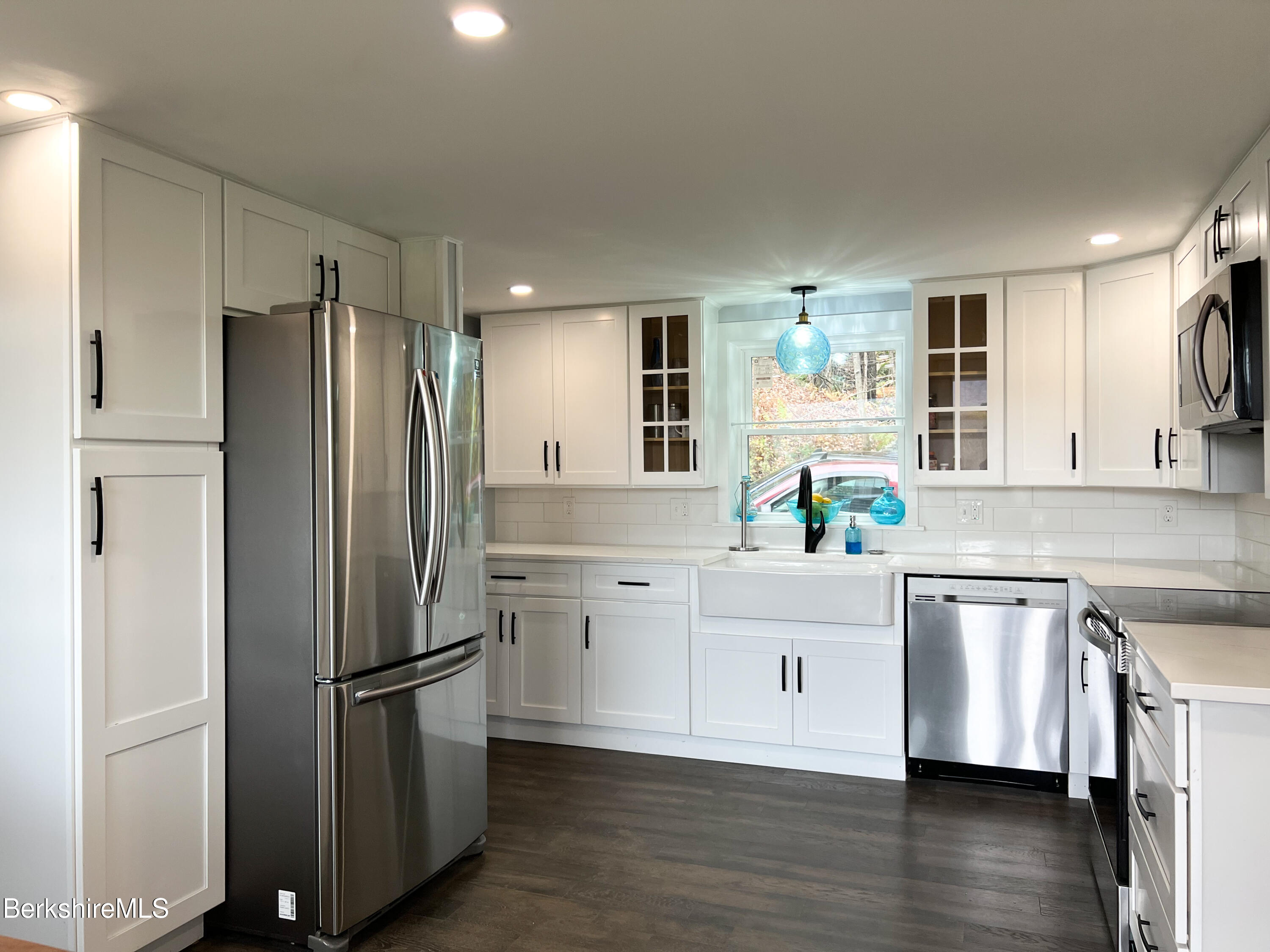 910 Daniels Road Clarksburg, MA 01247 - Photo 10 of 41 a kitchen with stainless steel appliances a refrigerator sink and cabinets