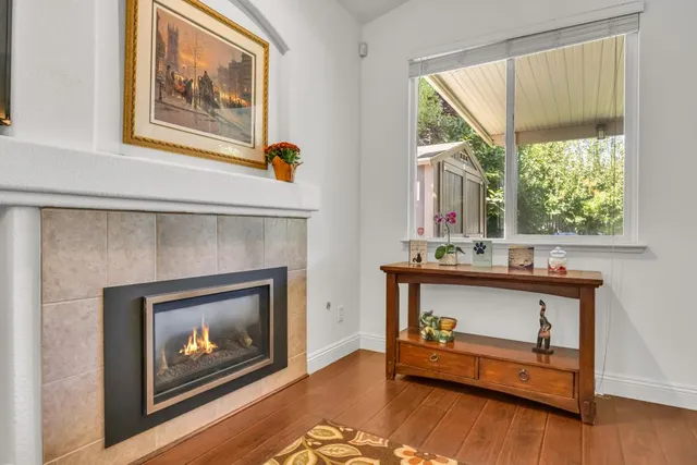 a kitchen with stainless steel appliances granite countertop a sink refrigerator and cabinets