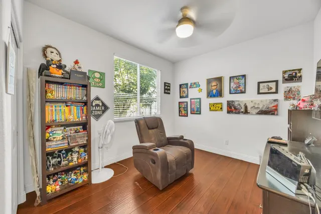 a bedroom with a bed and a television