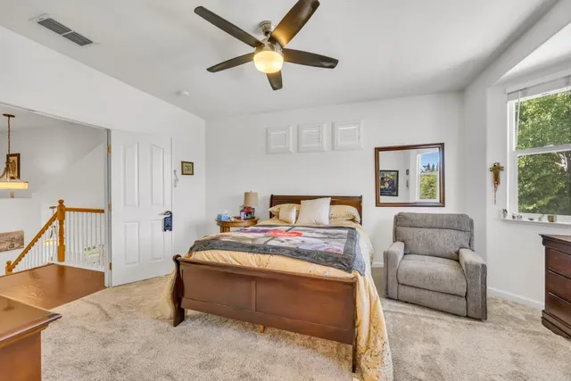 a view of walk in closet with clothes