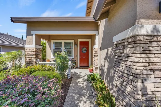 a view of a chairs and table in the balcony