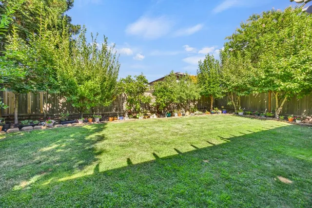 a view of a porch with chairs and backyard