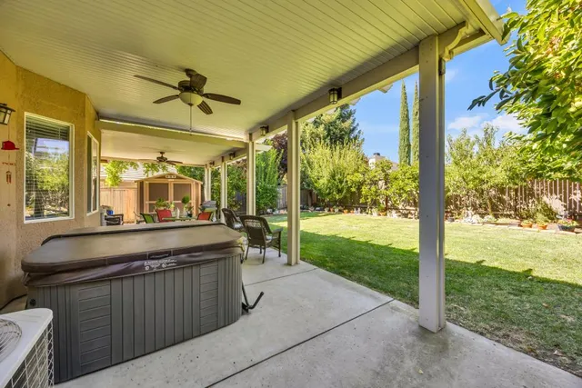 an aerial view of a house with a garden and lake view