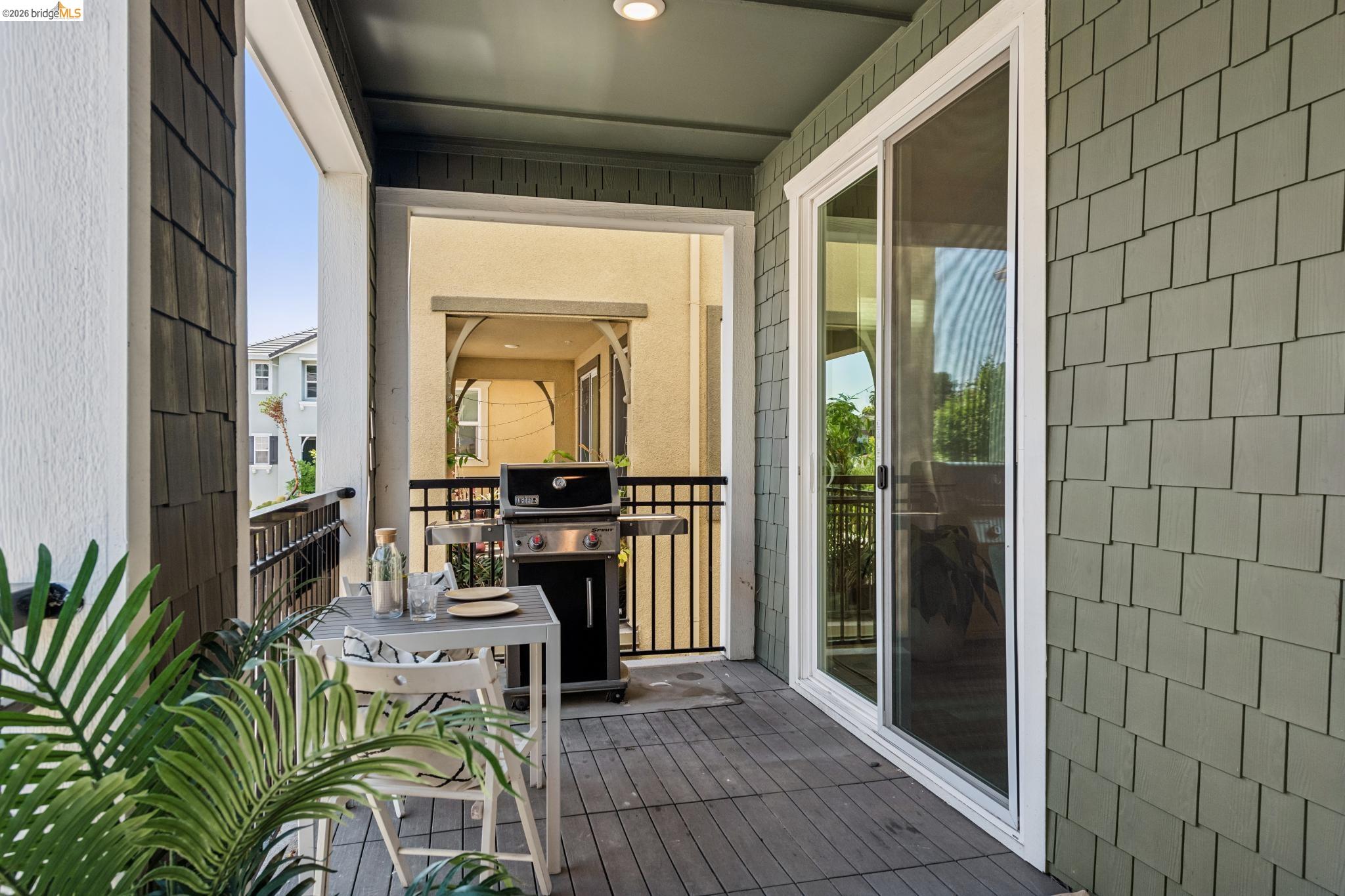24157 Amaranth Loop Hayward, CA 94541 - Photo 52 of 63 Shaded balcony featuring plank flooring, shaker siding, and a sliding glass door