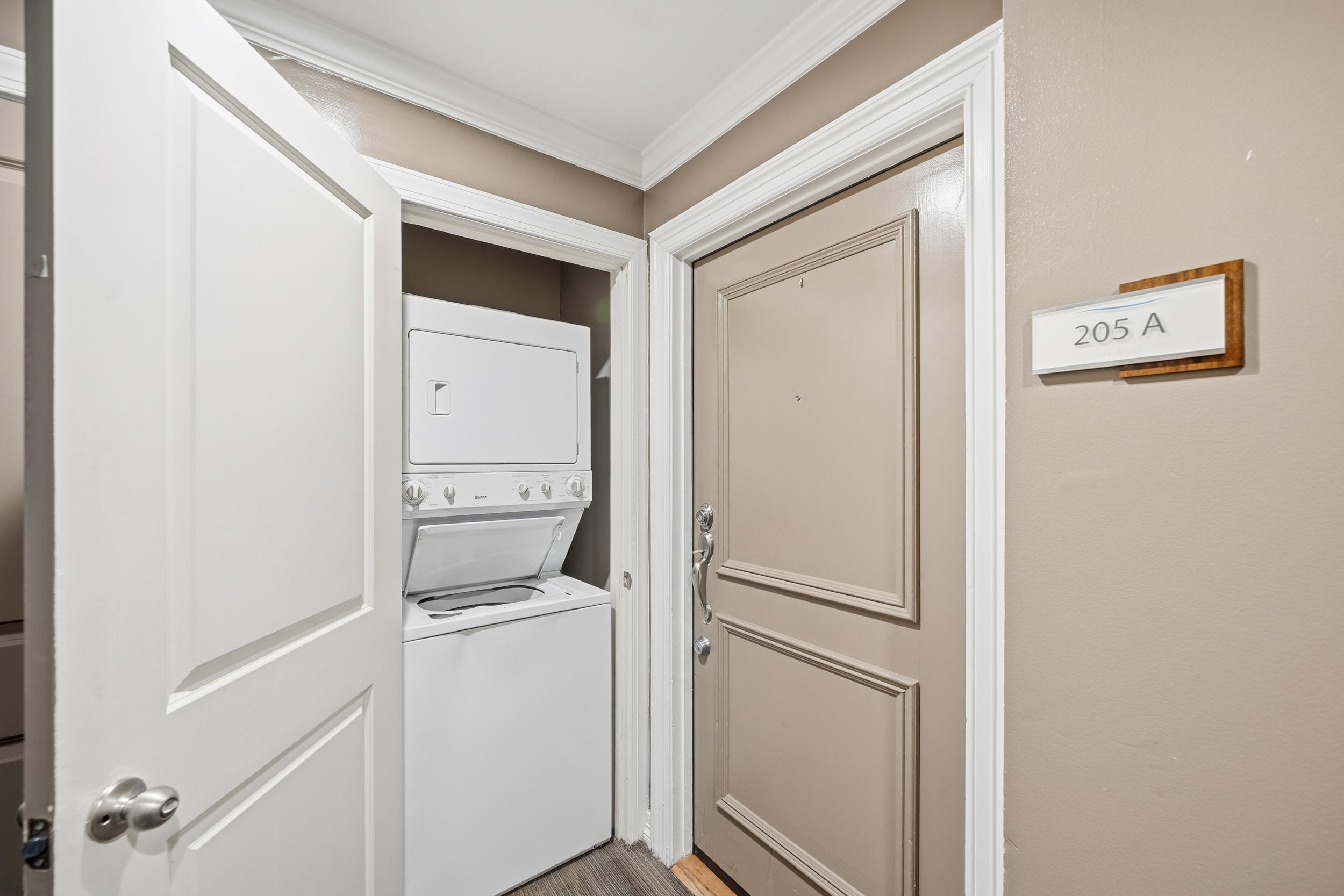 655 Riverside Drive, Unit 205A Memphis, TN 38103 - Photo 11 of 24 a room with a washer and dryer