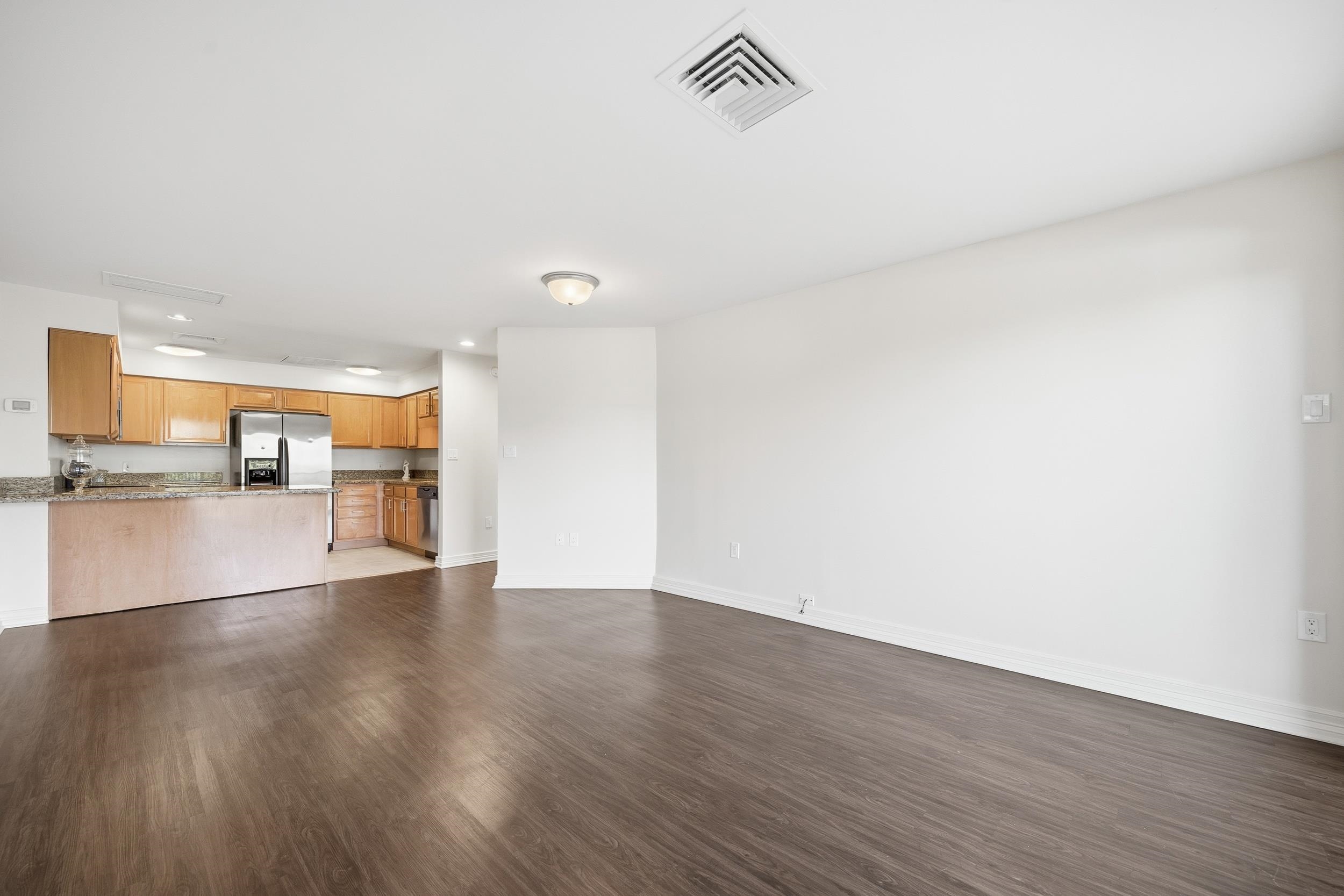 655 Riverside Drive, Unit 205A Memphis, TN 38103 - Photo 5 of 24 a view of empty room with wooden floor
