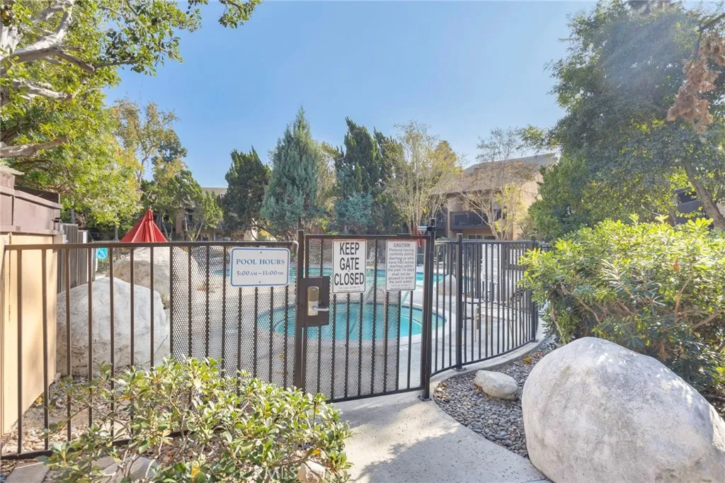 7890 East Spring Street, Unit 4A Long Beach, CA 90815 - Photo 20 of 21 a view of a fence