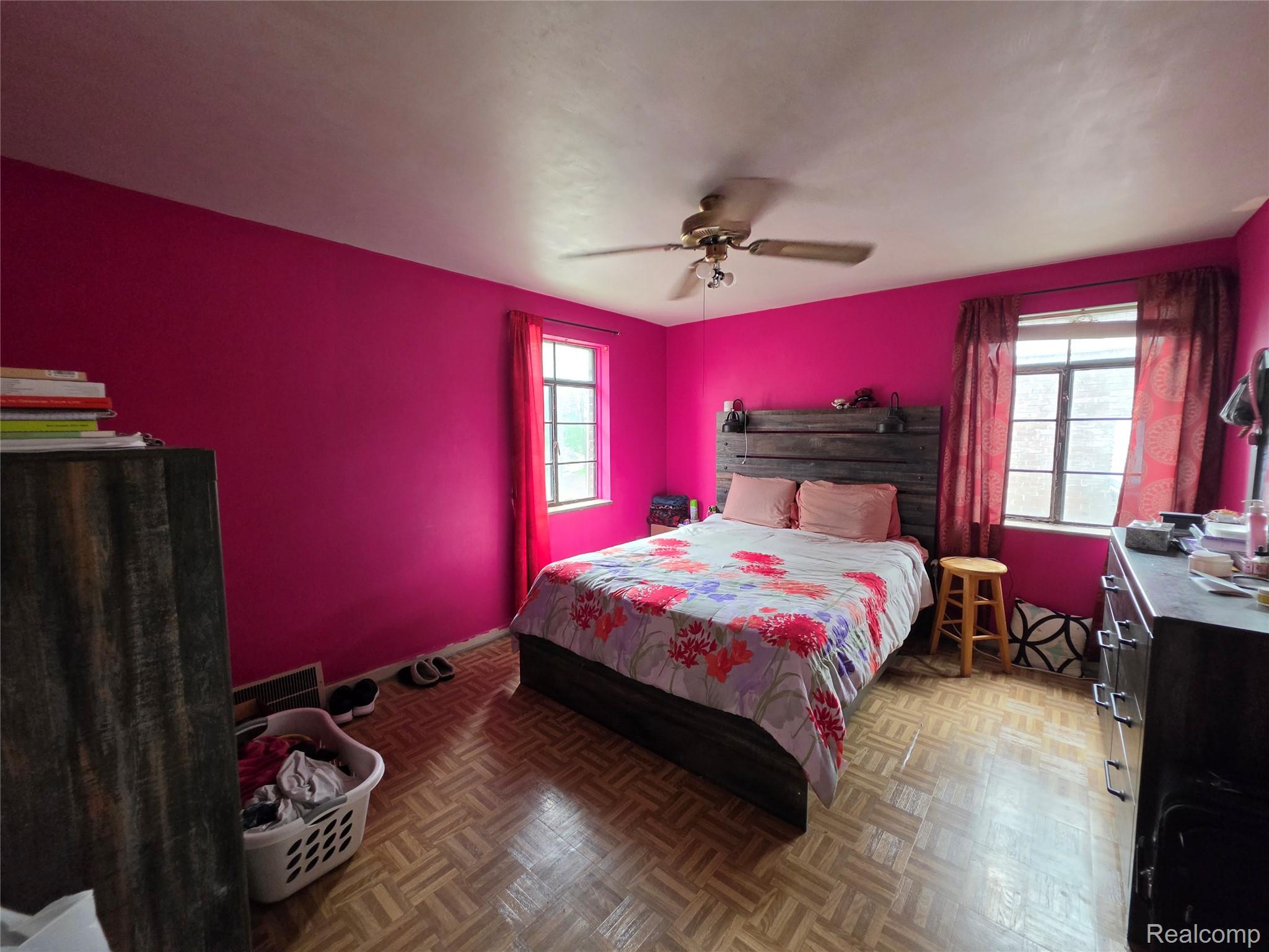 15832 Griggs Street Detroit, MI 48238 - Photo 20 of 24 Spacious room featuring wood-finish parquet flooring and bright walls