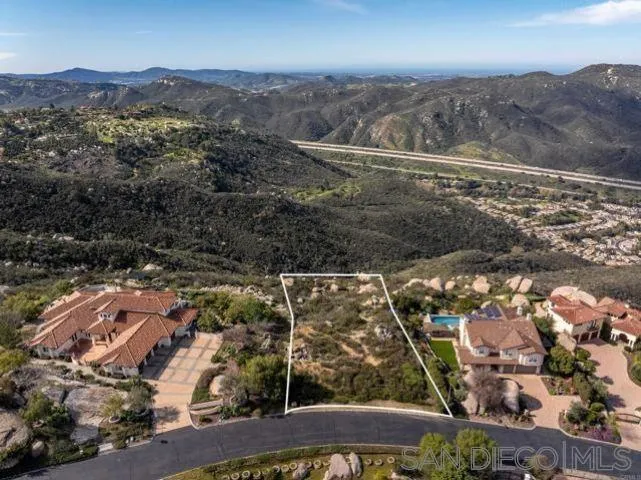 Meadow Glen Way, Unit 56 Escondido, CA 92026 - Photo 1 of 8 an aerial view of residential houses with outdoor space