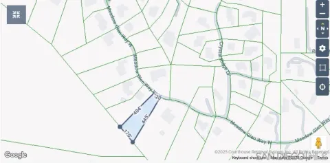 a view of a yard with large trees