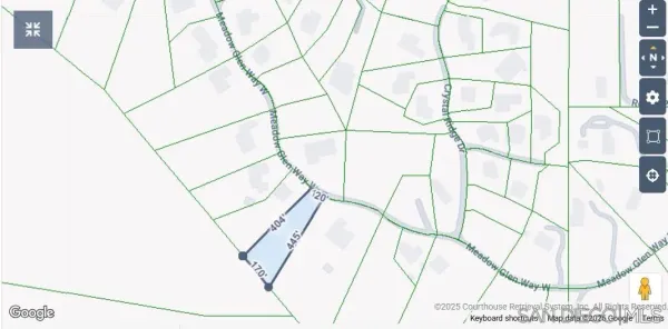 a view of a yard with large trees