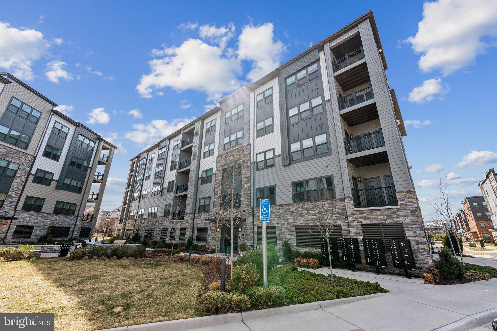 12875 Mosaic Pk Way, Unit 4J Herndon, VA 20171 - Photo 1 of 26 a view of a building with a street