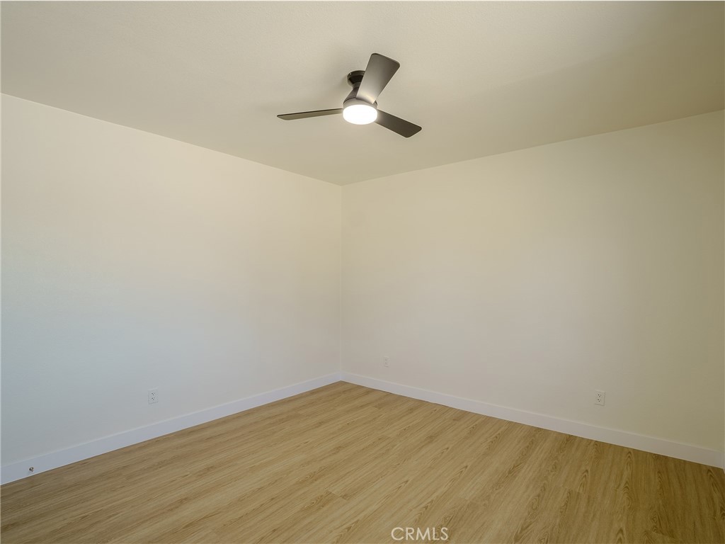 21865 Fox Apple Valley, CA 92307 - Photo 11 of 27 a view of empty room with wooden floor