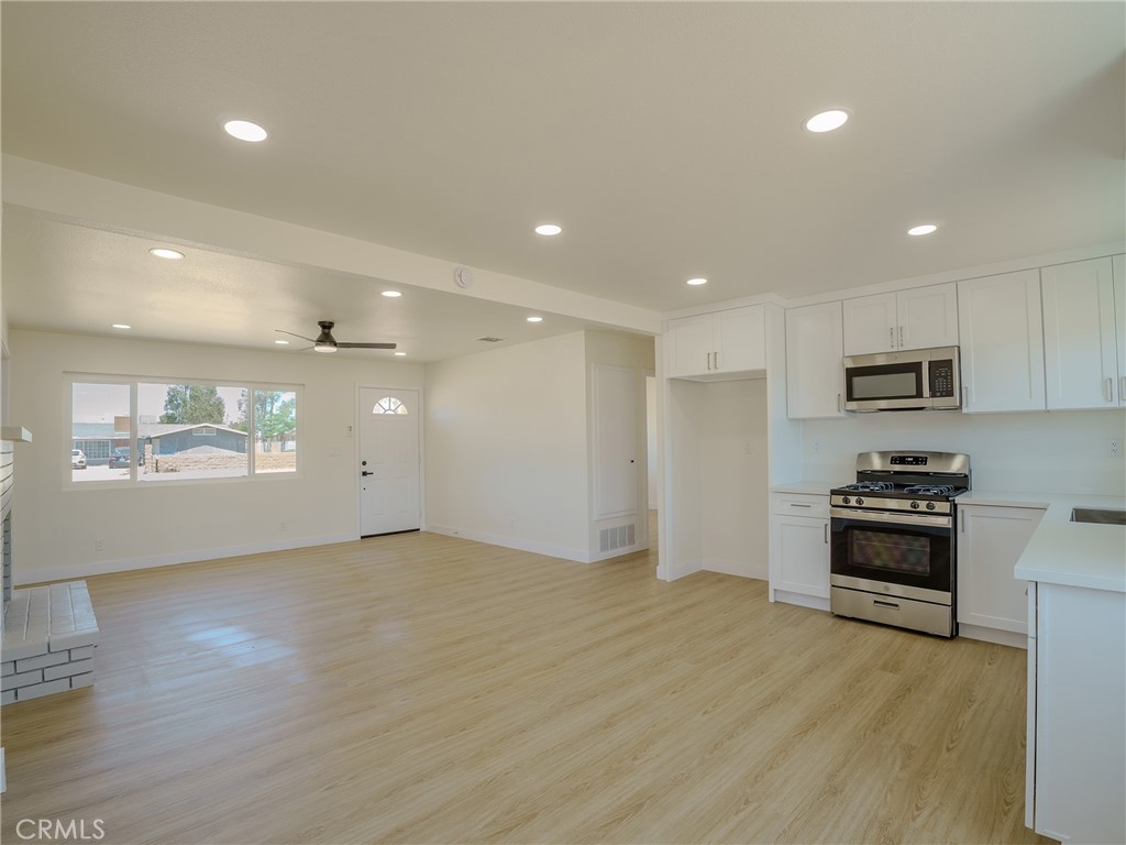 21865 Fox Apple Valley, CA 92307 - Photo 3 of 27 a view of kitchen with stainless steel appliances refrigerator sink and stove
