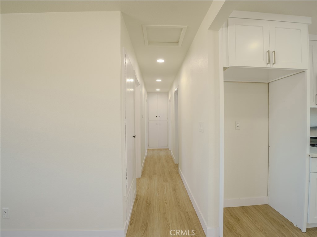 21865 Fox Apple Valley, CA 92307 - Photo 8 of 27 a view of a hallway with wooden floor and staircase