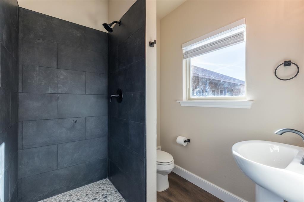 126 Phoenix Lane Tuscola, TX 79562 - Photo 11 of 40 a bathroom with a toilet a sink and shower