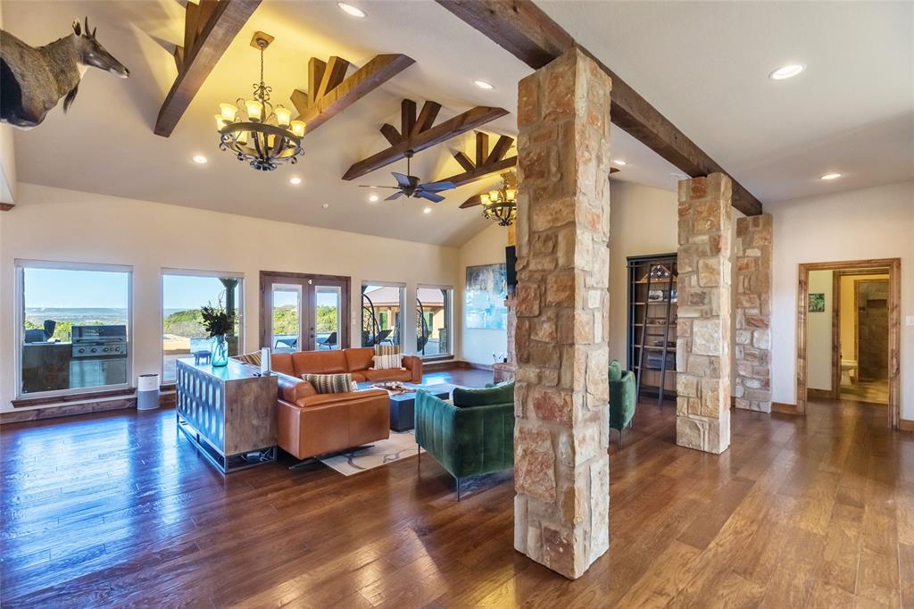126 Phoenix Lane Tuscola, TX 79562 - Photo 16 of 40 a living room with fireplace furniture and a wooden floor