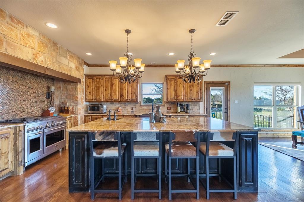 126 Phoenix Lane Tuscola, TX 79562 - Photo 18 of 40 a large kitchen with a table and chairs