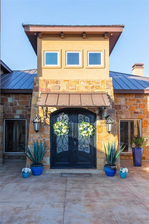 126 Phoenix Lane Tuscola, TX 79562 - Photo 2 of 40 a view of a fireplace with a potted plant and a table