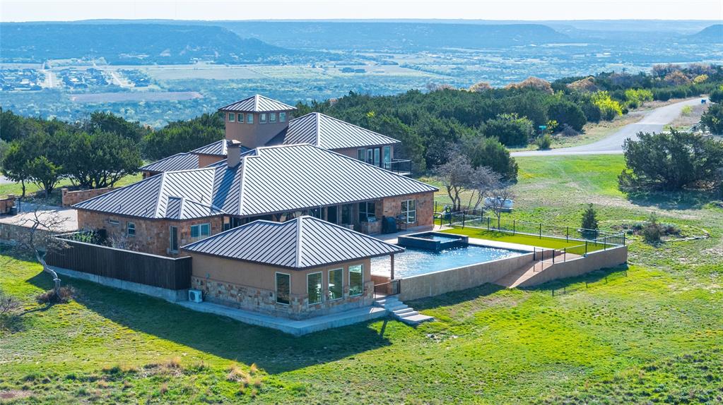 126 Phoenix Lane Tuscola, TX 79562 - Photo 3 of 40 an aerial view of a house with swimming pool garden and lake view