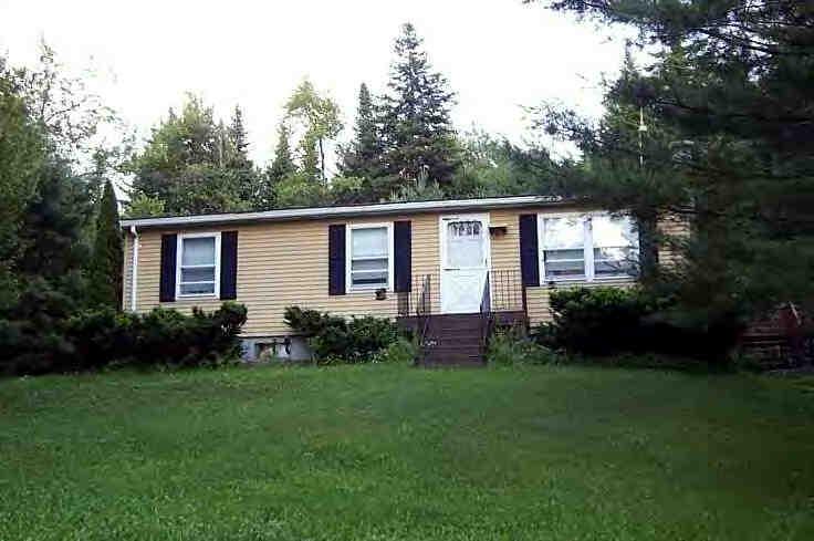 22 East Windsor Road Peru, MA 01235 - Photo 1 of 1 a front view of house with a garden