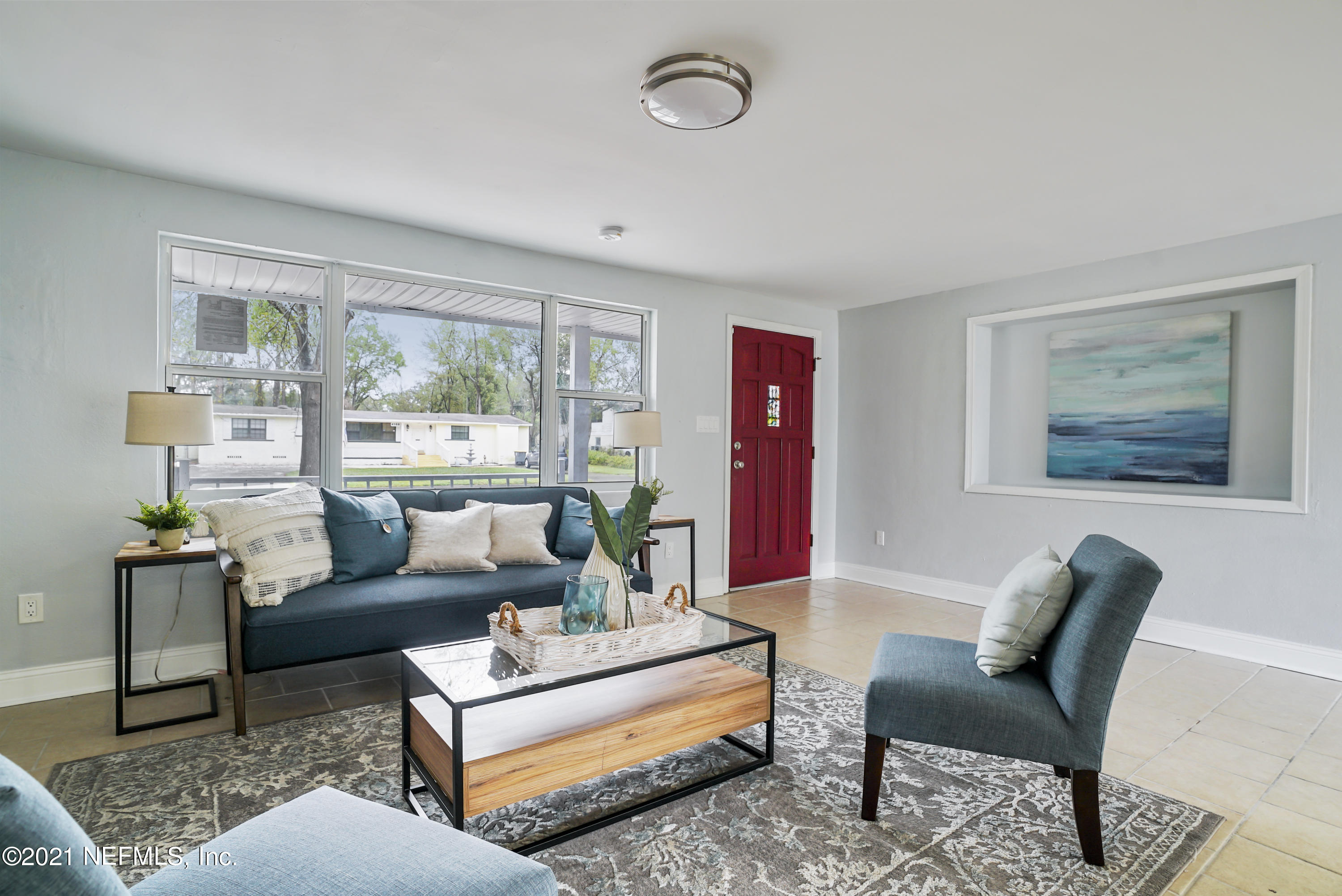 4175 Spring Glen Road Jacksonville, FL 32207 - Photo 1 of 25 a living room with furniture and a large window