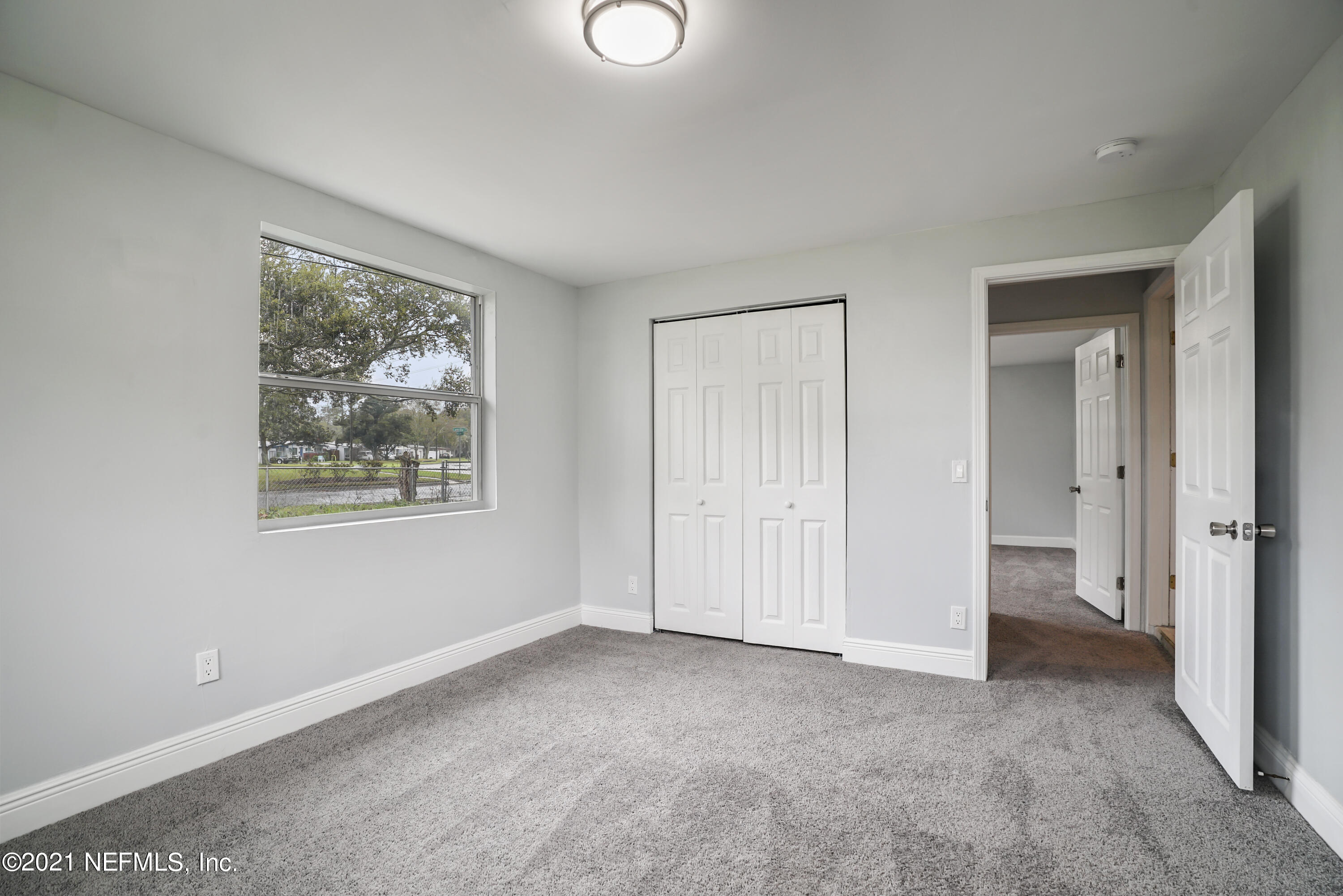 4175 Spring Glen Road Jacksonville, FL 32207 - Photo 16 of 25 a view of an empty room with a window