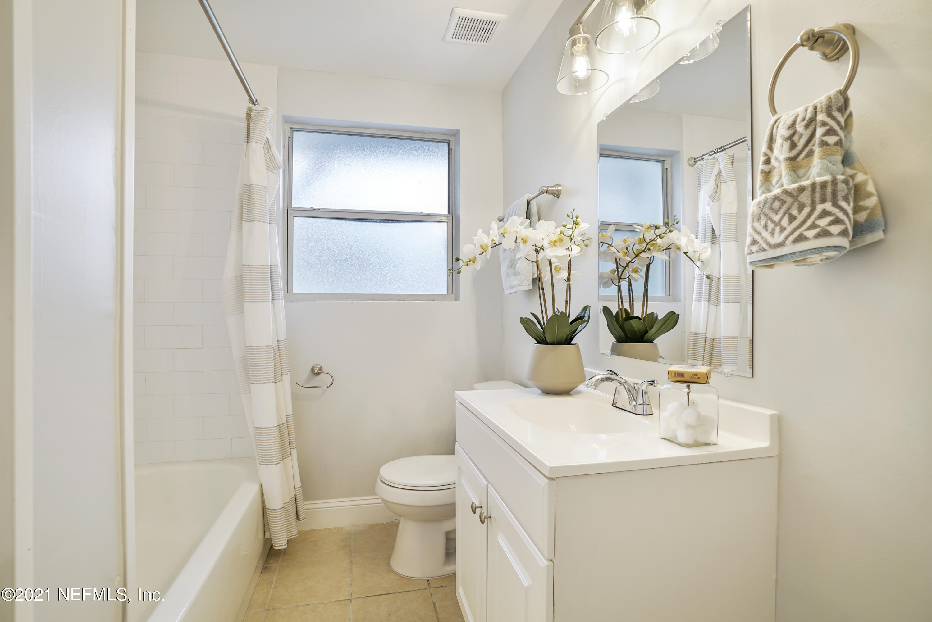 4175 Spring Glen Road Jacksonville, FL 32207 - Photo 19 of 25 a bathroom with a sink a toilet and shower