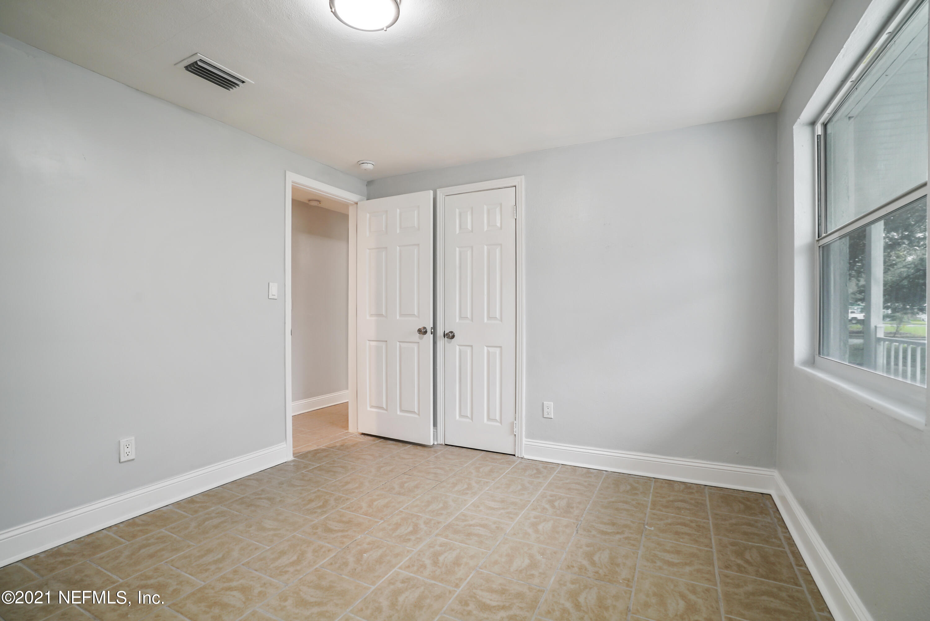 4175 Spring Glen Road Jacksonville, FL 32207 - Photo 21 of 25 a view of an empty room with a window