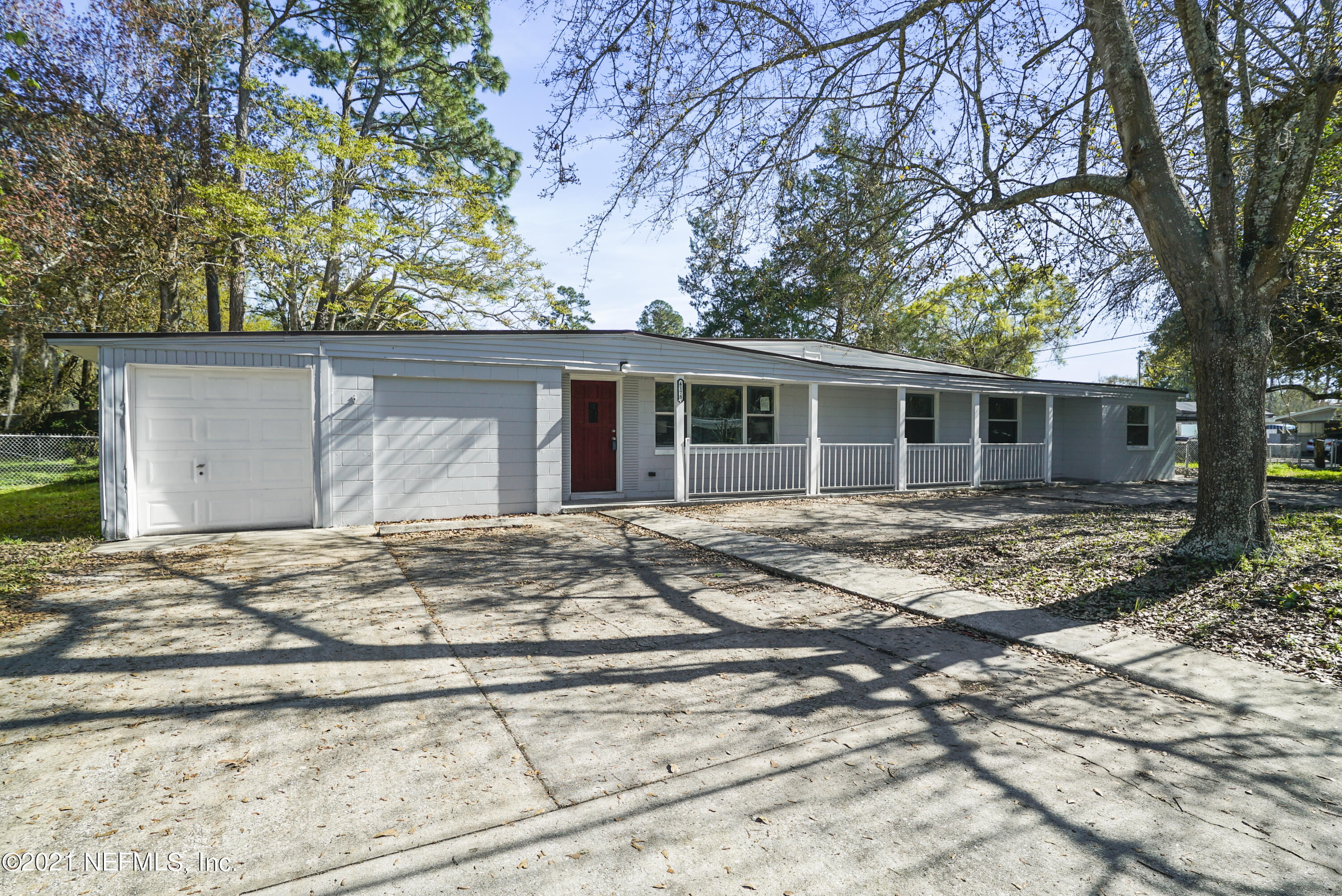 4175 Spring Glen Road Jacksonville, FL 32207 - Photo 6 of 25 a house with trees in front of it