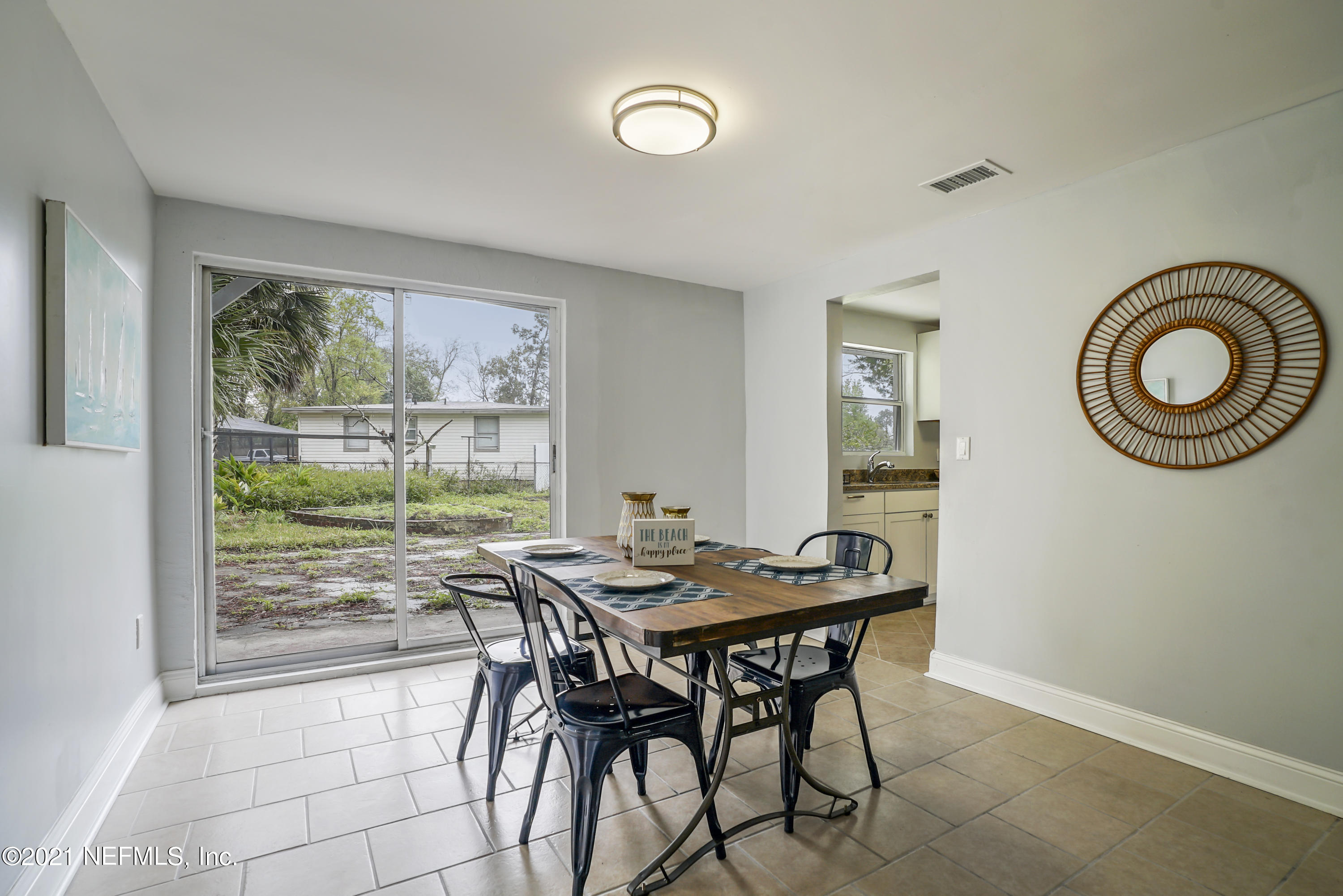 4175 Spring Glen Road Jacksonville, FL 32207 - Photo 7 of 25 a dining room with furniture and window