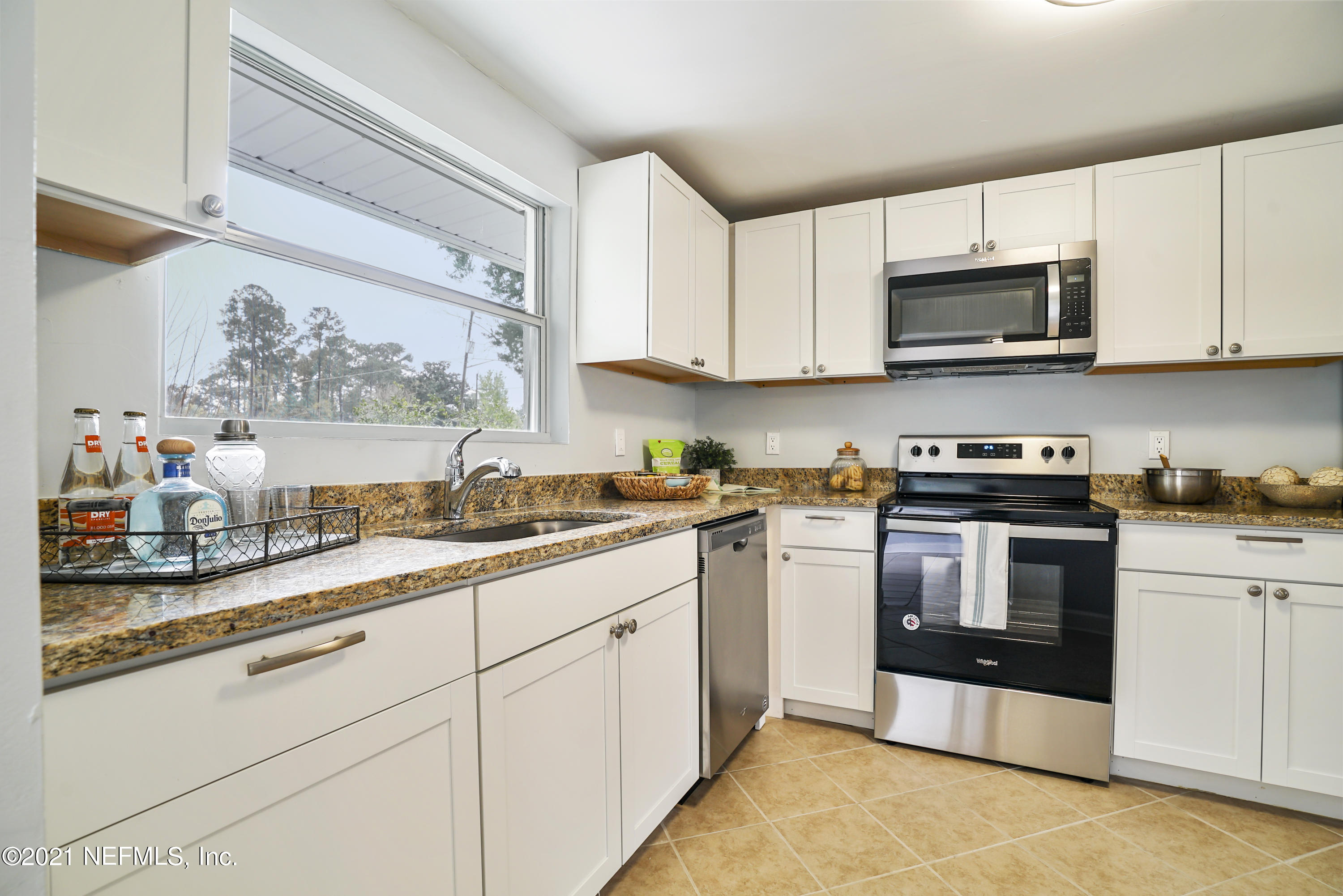 4175 Spring Glen Road Jacksonville, FL 32207 - Photo 9 of 25 a kitchen with stainless steel appliances granite countertop a sink and a stove