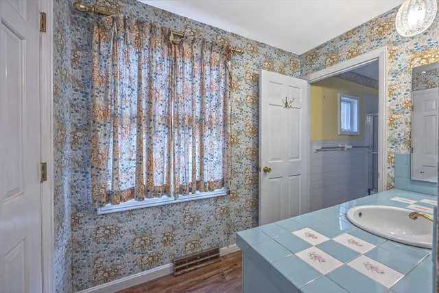 a bathroom with a sink and a mirror