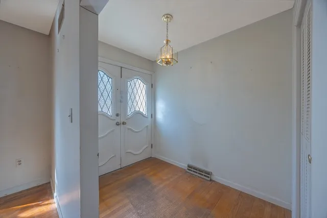 a view of a livingroom with wooden floor