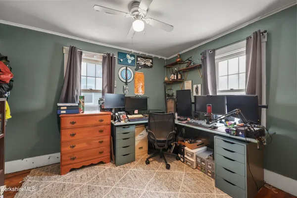 a room with cabinets furniture and a window