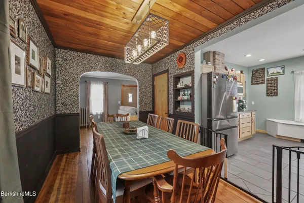 a view of a dining room with furniture window and wooden floor