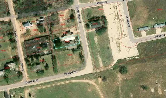 a front view of a house with yard and garage