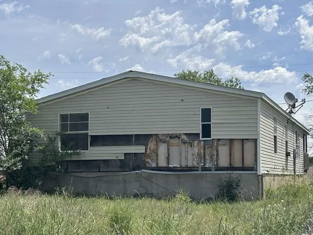 a view of a balcony with wooden floor