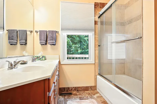 a bathroom with a bathtub and a sink