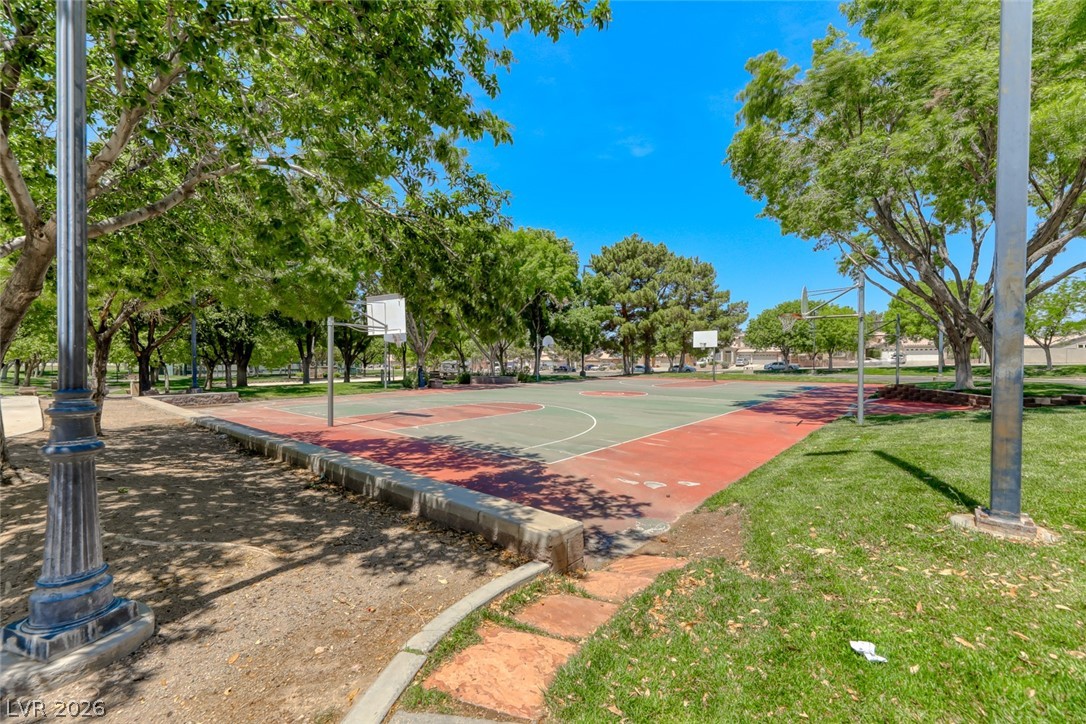2001 Appaloosa Road Henderson, NV 89002 - Photo 13 of 44 This vibrant basketball court is an ideal place for active recreation amidst lush greenery.
