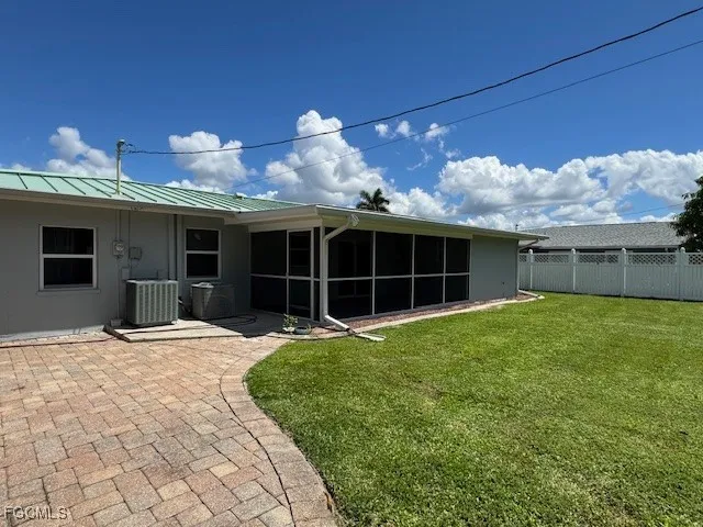 a view of a house with a yard and garage