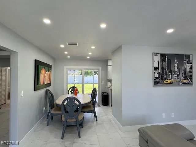 a living room with furniture and gym equipment