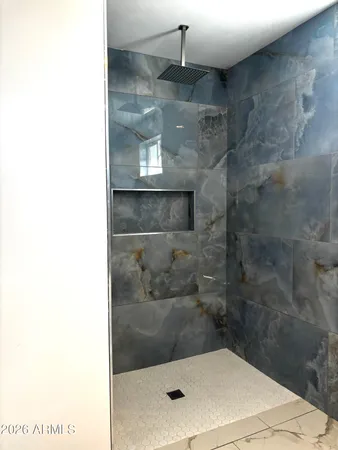 a bathroom with a sink and shower
