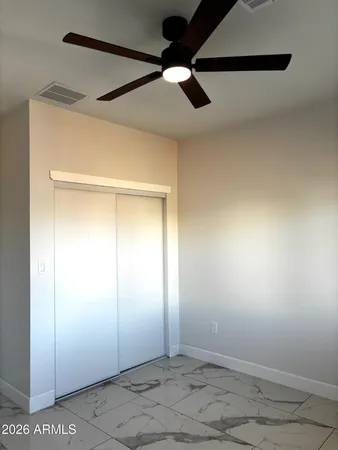an empty room with fan