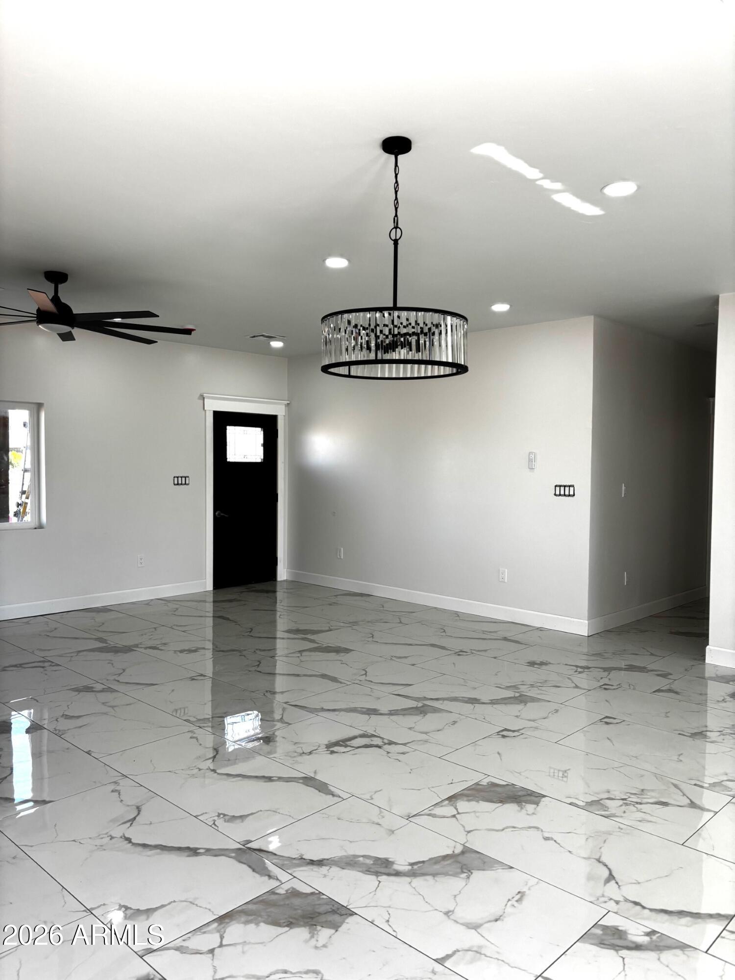 4000 Santa Fe Avenue Douglas, AZ 85607 - Photo 3 of 16 a view of a room with a chandelier